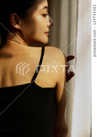Skin care image of a young woman photographed in warm tones Skin care image of a young woman photographed in warm tones 124743381