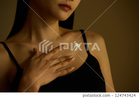 Skin care image of a young woman photographed in warm tones Skin care image of a young woman photographed in warm tones 124743424