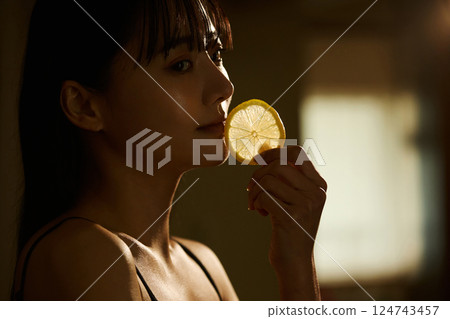 Skin care image of a young woman photographed in warm tones 124743457