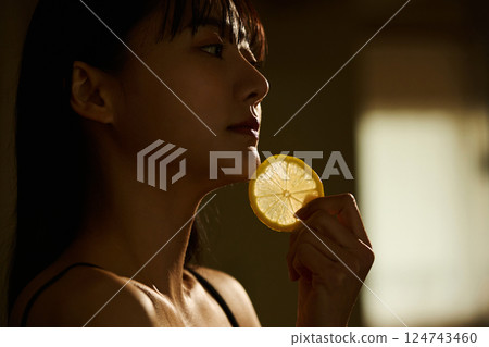 Skin care image of a young woman photographed in warm tones Skin care image of a young woman photographed in warm tones 124743460