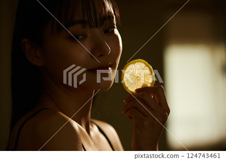 Skin care image of a young woman photographed in warm tones Skin care image of a young woman photographed in warm tones 124743461