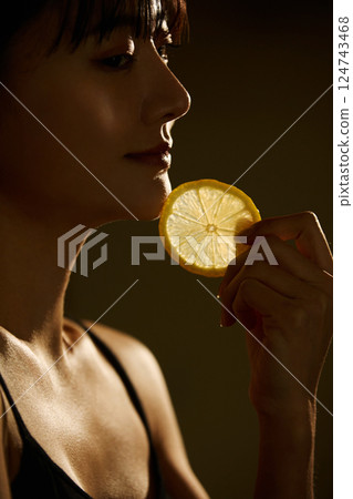 Skin care image of a young woman photographed in warm tones 124743468