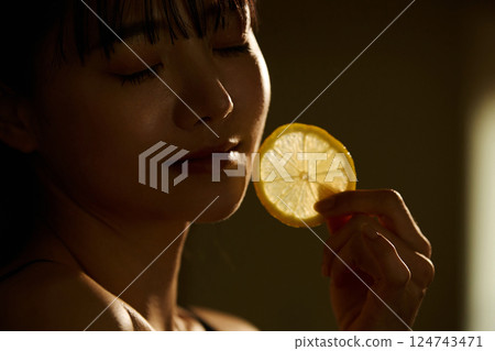 Skin care image of a young woman photographed in warm tones Skin care image of a young woman photographed in warm tones 124743471