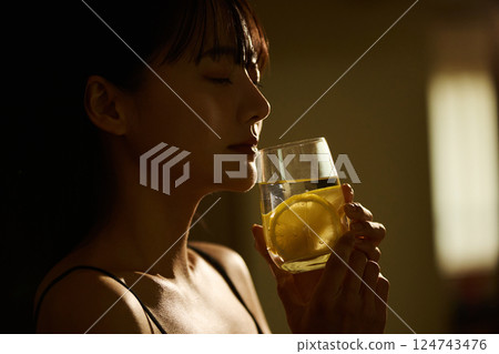 Skin care image of a young woman photographed in warm tones Skin care image of a young woman photographed in warm tones 124743476