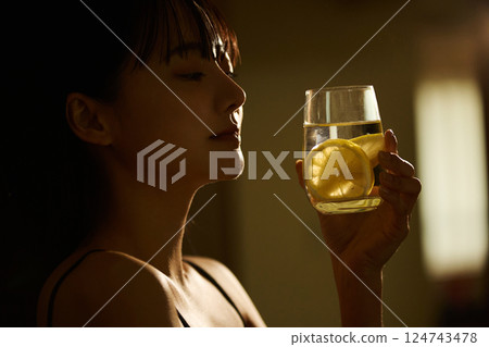 Skin care image of a young woman photographed in warm tones 124743478