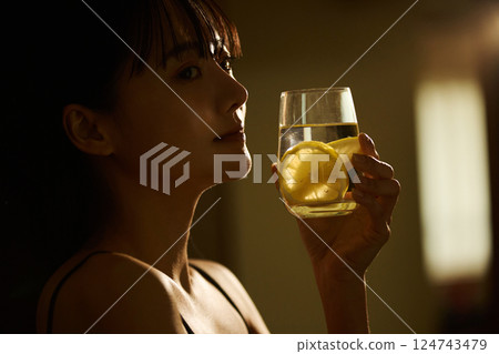 Skin care image of a young woman photographed in warm tones 124743479