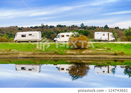 Campers rv camping at lake shore. Alentejo Portugal. 124743681