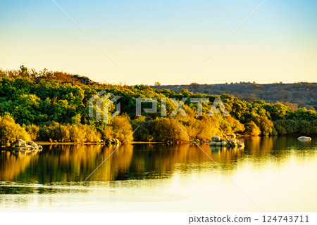 Autumn lake landscape, Alentejo Portugal. Autumn lake landscape, Alentejo Portugal. 124743711