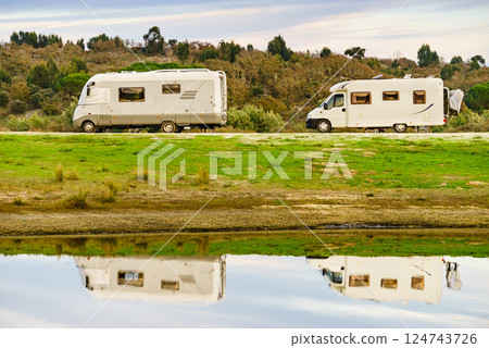 Campers rv camping at lake shore. Alentejo Portugal. 124743726