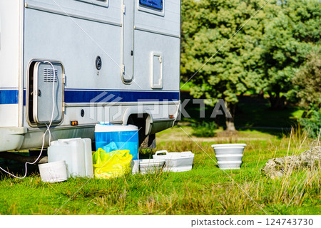 Washing laundry outdoor at caravan 124743730