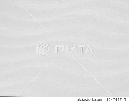 Subtle white waves on a textured paper surface with an organic flow 124743745