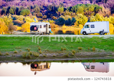 Campers rv camping at lake shore. Alentejo Portugal. 124743818