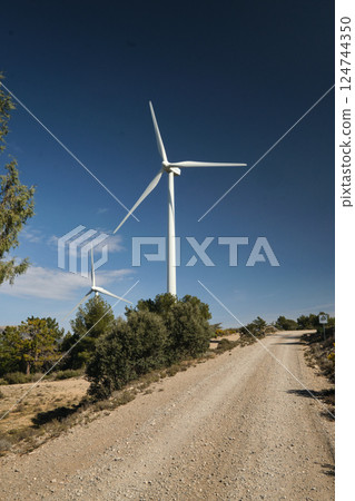 a wind turbine against the background of the blue sky a wind turbine against the background of the blue sky 124744350