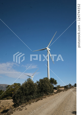 Wind turbine with blue sky at background Wind turbine with blue sky at background 124744352
