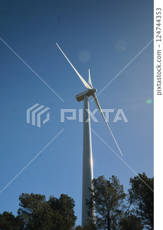 Wind turbine with blue sky at background Wind turbine with blue sky at background 124744353