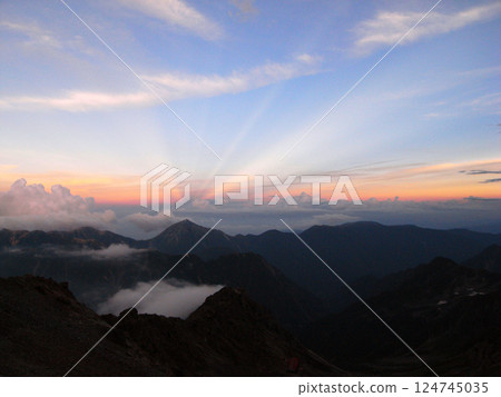 Radiating light seen from the summit Radiating light seen from the summit 124745035