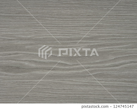 A serene expanse of ash veneer unfolds in shades of slate gray and silver, offering a modern, minimalist appeal A serene expanse of ash veneer unfolds in shades of slate gray and silver, offering a modern, minimalist appeal 124745147