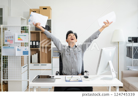 asian businessman are excited business success with inspiration from their excellent financial results that are happy working in a modern office on a computer. asian businessman are excited business success with inspiration from their excellent financial results that are happy working in a modern office on a computer. 124745339