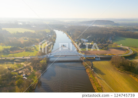 Bohumil Hrabal's Bridge elegantly crosses over the Labe River in Litol, Lysa nad Labem, Czechia, amidst lush greenery and serene landscapes during a bright day. Bohumil Hrabal's Bridge elegantly crosses over the Labe River in Litol, Lysa nad Labem, Czechia, amidst lush greenery and serene landscapes during a bright day. 124745739