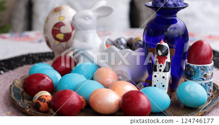 Coloring egg activity with Easter eggs in a still life arrangement featuring vibrant hues and decorative items celebrating the holiday spirit Coloring egg activity with Easter eggs in a still life arrangement featuring vibrant hues and decorative items celebrating the holiday spirit 124746177