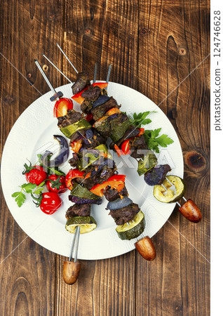 Metal skewers with delicious roe meat. 124746628