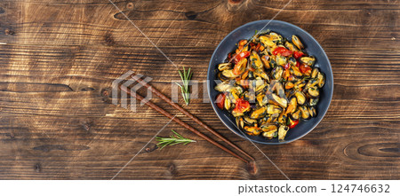 Plate of mussels on a table. Plate of mussels on a table. 124746632