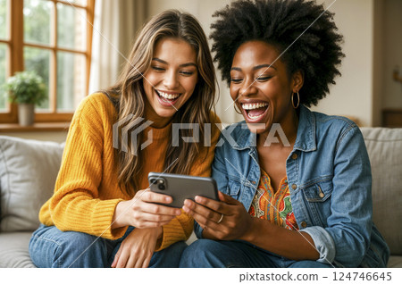 Happy young women laughing while watching content on smartphone. AI generated 124746645