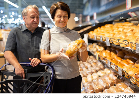 Couple chooses bread in store Couple chooses bread in store 124746944