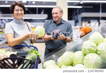 Husband and wife choose cabbage in vegetable department 124746949
