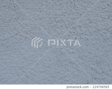 plastered wall surface with frozen textured streaks and dust in texture folds, abstract light gray background with lip relief, fragment of rough plaster full frame close-up 124748565