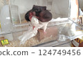 Hamster playing with tissue 124749456