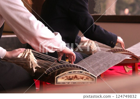 Hands playing the koto Hands playing the koto 124749832