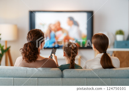Mother and children watching  TV 124750101