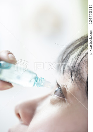 A woman representing an eye drop 124750112