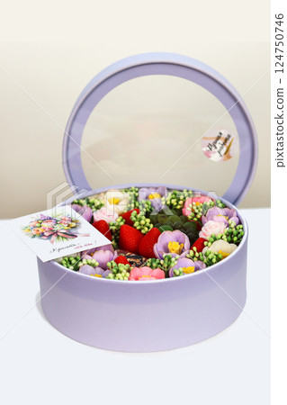 Dubai, UAE - November 13, 2024 A box with a set of handmade soaps in the form of flowers and berries with a card for mom. Editorial Dubai, UAE - November 13, 2024 A box with a set of handmade soaps in the form of flowers and berries with a card for mom. Editorial 124750746