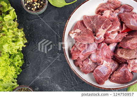 Raw deer venison prepared for a cooking process. 124750957