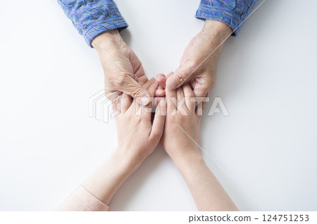 Grandmother and grandchild holding hands 124751253