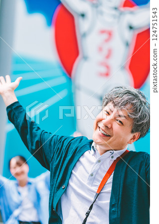 A father and daughter enjoying sightseeing in Osaka together A father and daughter enjoying sightseeing in Osaka together 124751543