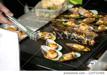 Grilled Seafood On Hot Cooking Surface Grilled Seafood On Hot Cooking Surface 124752488
