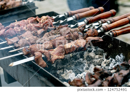Meat Skewers Grilling Over Hot Coals Meat Skewers Grilling Over Hot Coals 124752491
