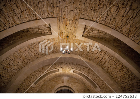 Wine cellar stone arch ceiling indoor. 124752638