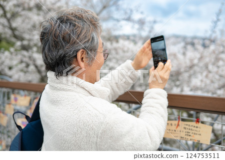 man taking photo with smartphone 124753511