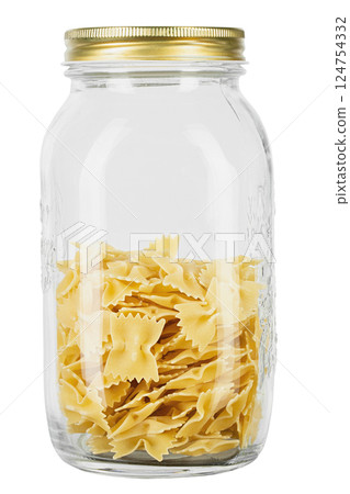 Farfalle pasta in a glass jar for storing bulk products isolated on white background. 124754332