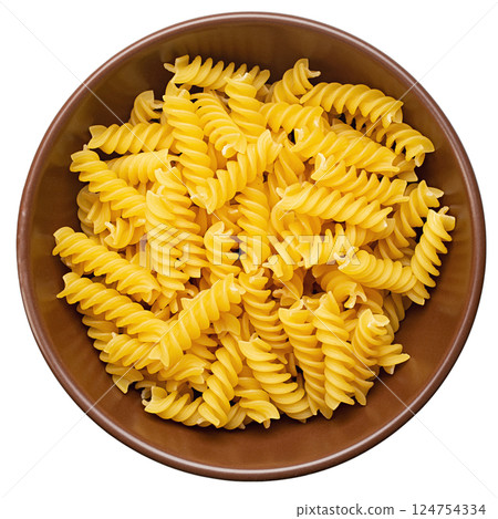 Raw pasta Fusilli in bowl isolated on white background. Raw and Dry Macaroni. Italian Culture. Raw pasta Fusilli in bowl isolated on white background. Raw and Dry Macaroni. Italian Culture. 124754334