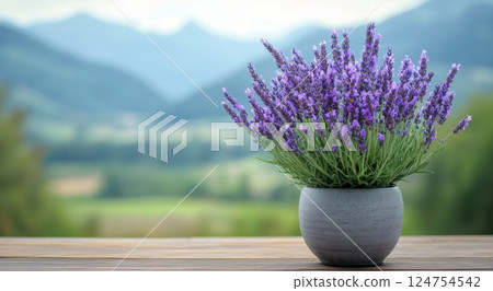 Lavender Bouquet in a Pot Against a Scenic Mountain Landscape During Sunset Lavender Bouquet in a Pot Against a Scenic Mountain Landscape During Sunset 124754542