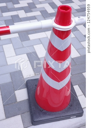 Triangular cone installed on the road Triangular cone installed on the road 124754959