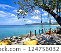 Tropical Paradise Shoreline with Ocean View Swing on Wooden Deck in Phuket, Thailand 124756032
