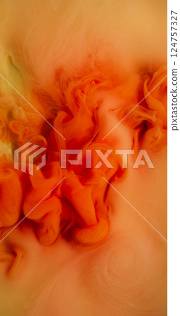 Fume paint. Flow art. Defocused pink orange yellow colorful liquid texture in acrylic water mix cloud soaring on abstract background. 124757327