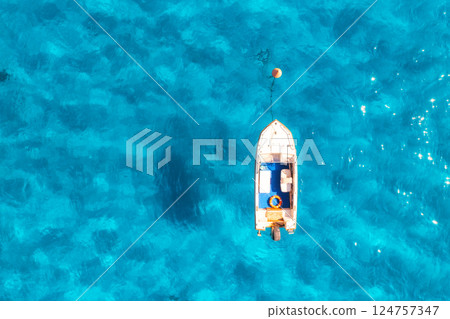 Aerial view of boat in blue sea in summer at sunset 124757347