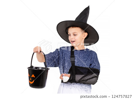 Portrait emotional boy black witch hat, bucket pumpkin Jack sweet candies. Isolated white background Portrait emotional boy black witch hat, bucket pumpkin Jack sweet candies. Isolated white background 124757827
